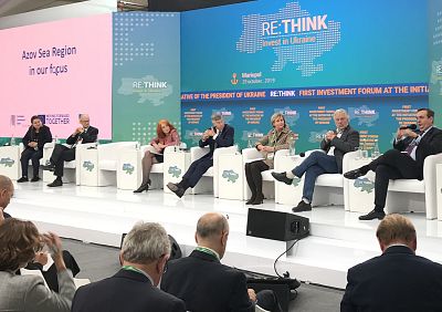 Panel members, including Ambassador Bill Taylor, appear on stage at an economic conference in Mariupol, Ukraine, on Oct. 29, 2019.