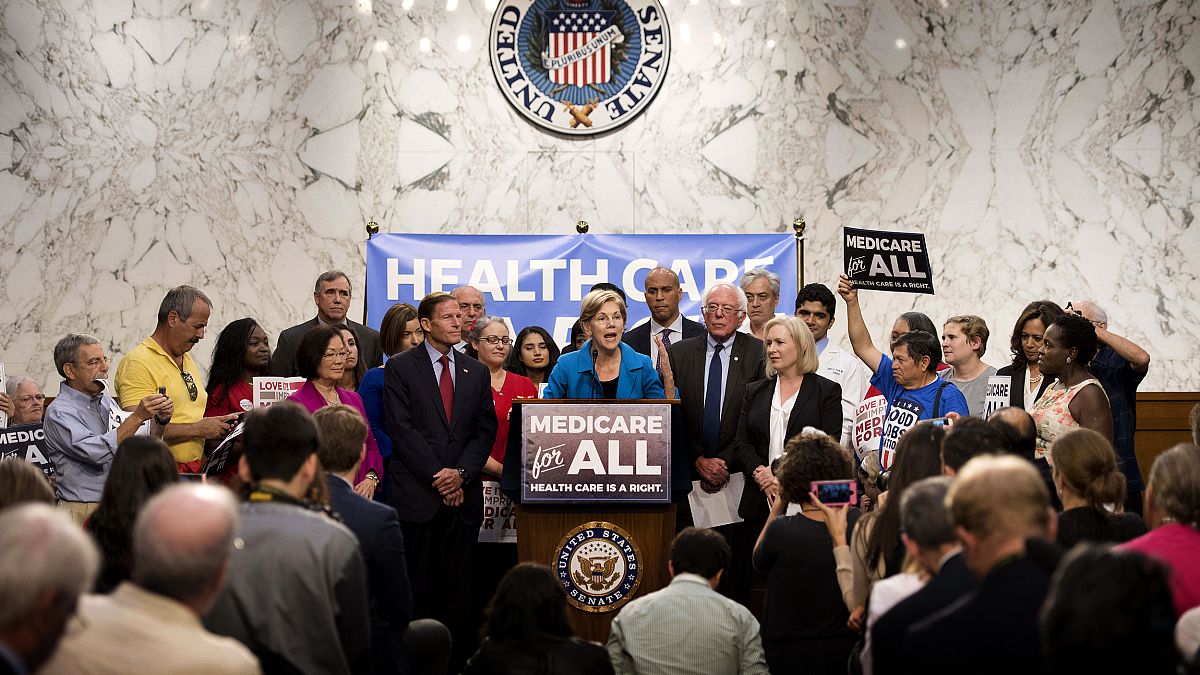 Image: Sen. Elizabeth Warren speaks alongside Sen. Bernie Sanders about Med