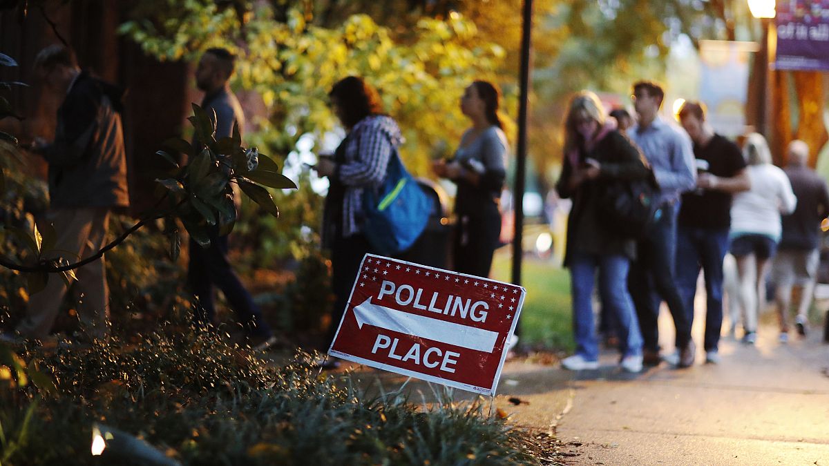 Image: A line forms outside a polling site on election day in Atlanta, Geor