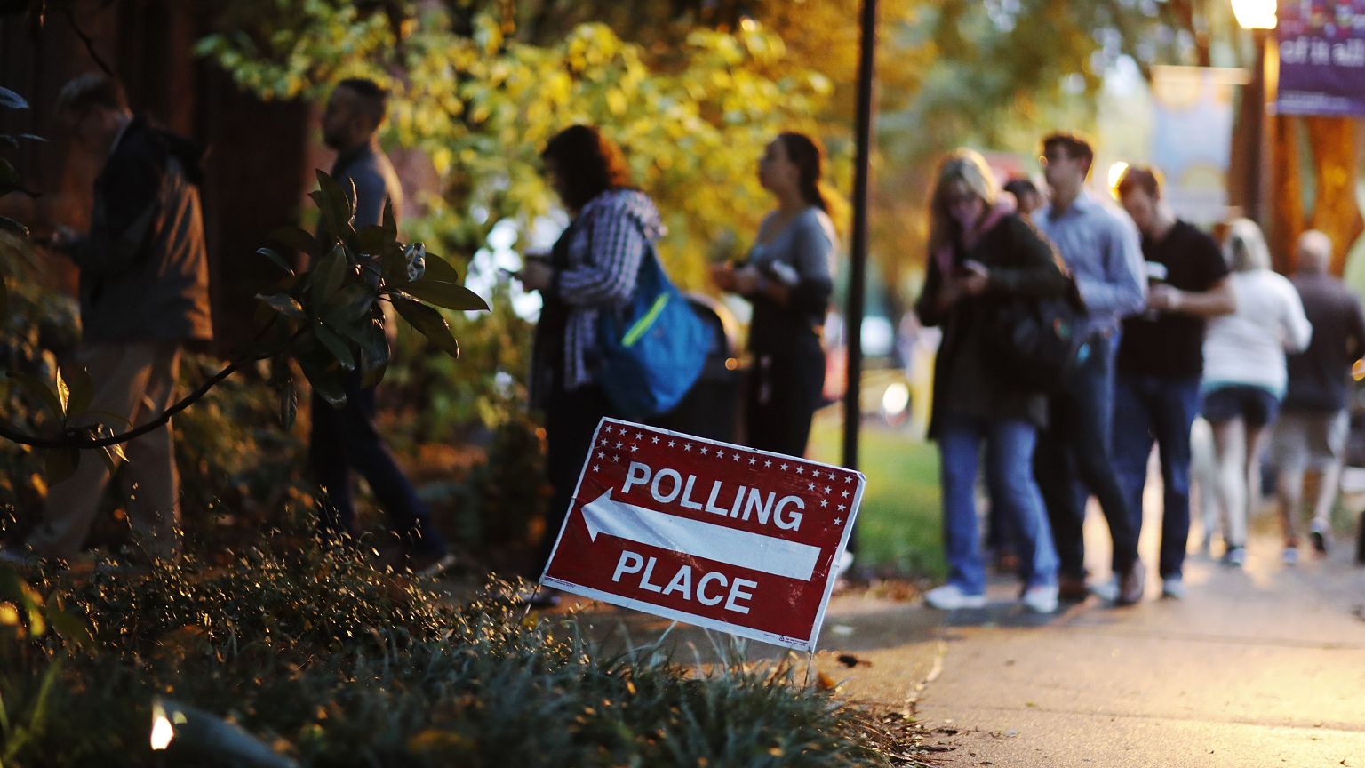 Image: A line forms outside a polling site on election day in Atlanta, Geor
