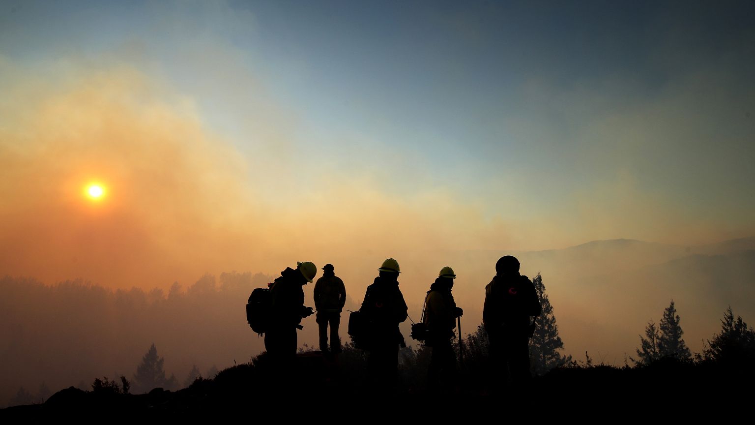 Image: Firefighters monitor the Kincade fire in Healdsburg, Calif., on Oct.