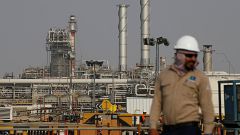 Image: An employee looks on at Saudi Aramco oil facility in Abqaiq