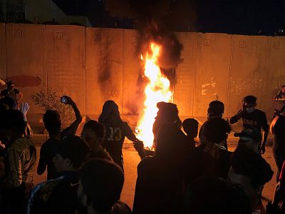 Demonstrators set fire to front of the Iranian consulate in Karbala Iraq on Sunday.