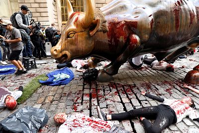 Climate change activists protest at the Wall Street Bull in Lower Manhattan during Extinction Rebellion protests in New York City on Oct. 7.