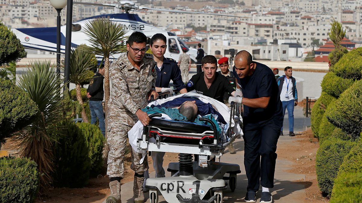 Image: Tourist, who was injured in a stabbing, is brought into King Hussein