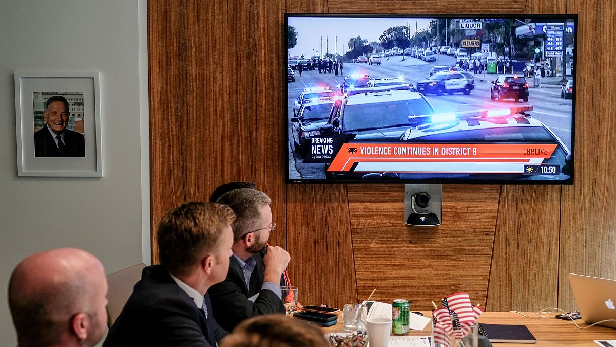 Images of an immersive simulation of mock news events are displayed during 