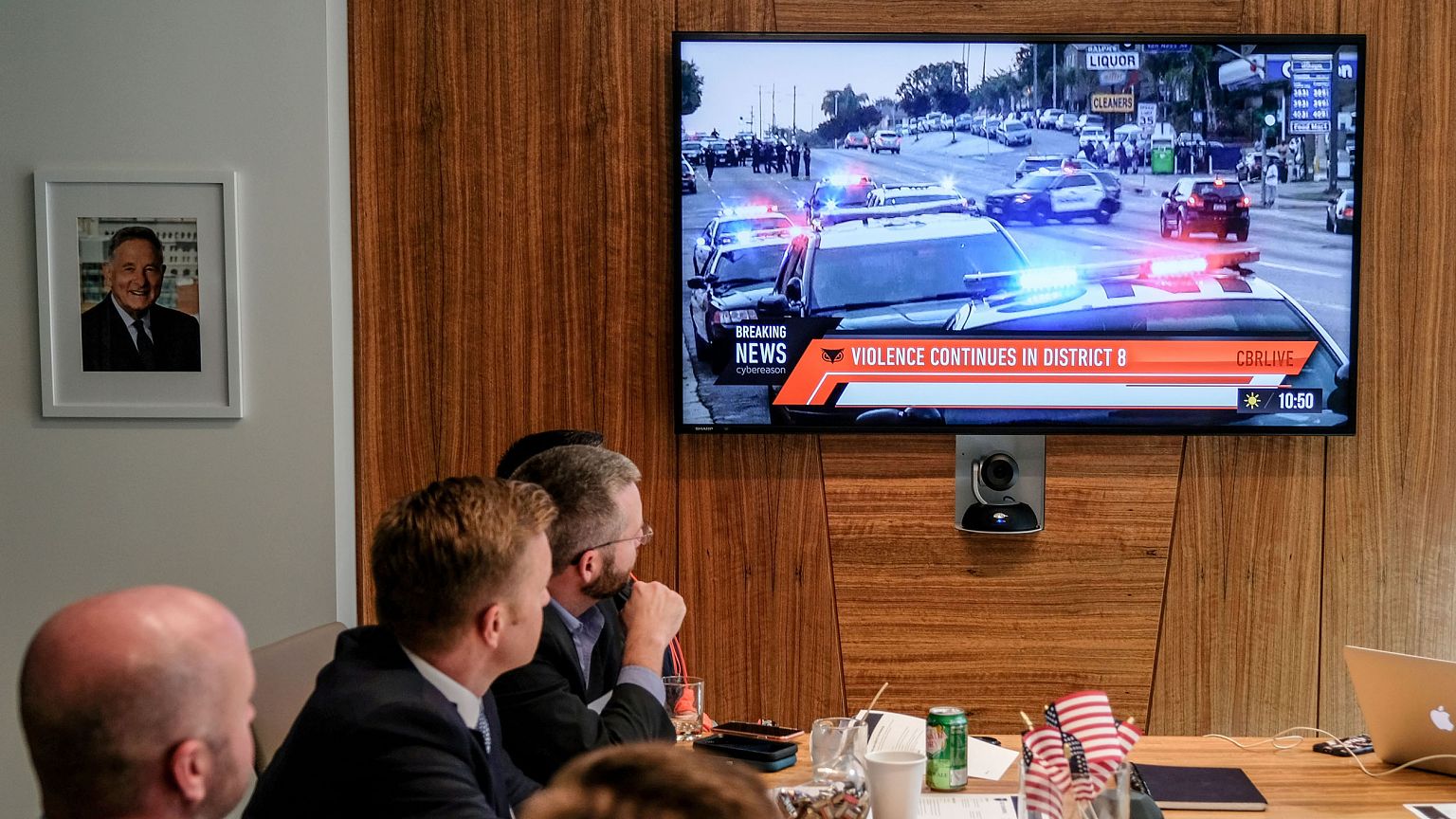 Images of an immersive simulation of mock news events are displayed during 