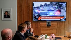 Images of an immersive simulation of mock news events are displayed during 