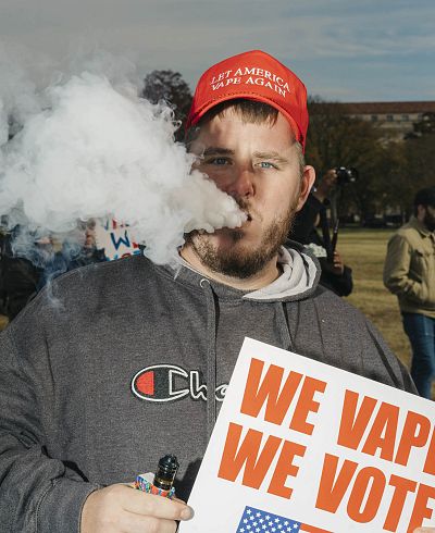 Travis Rush, 28, of Indianapolis, wears a "Let America Vape Again" hat at the rally.