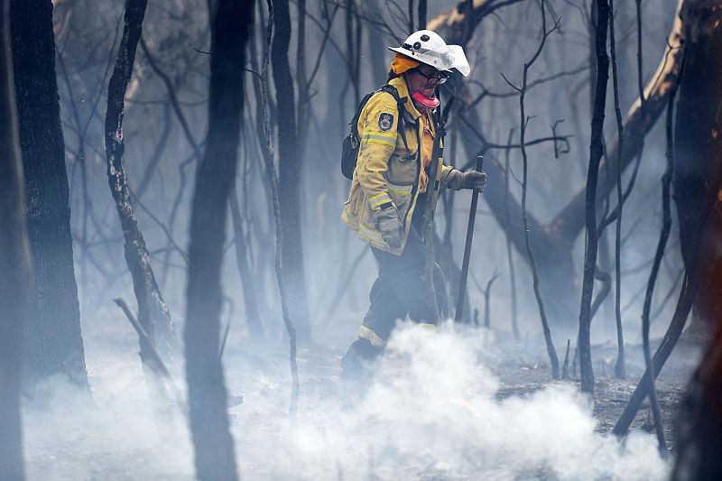 A NSW RFS firefighter undertakes mopping up at South Turramurra on Nov. 12, 2019 in Sydney, Australia