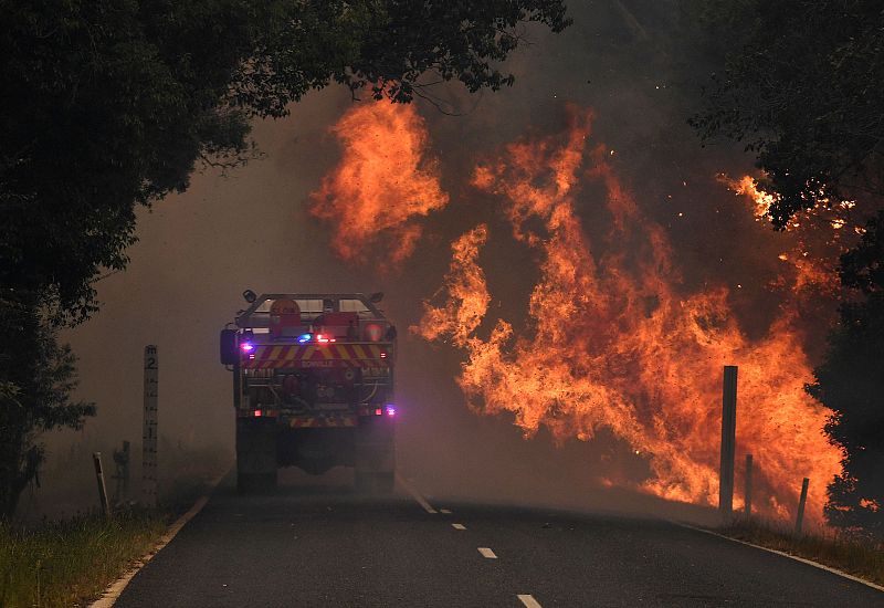 A fire truck near a bushfire in Nana Glen, near Coffs Harbour, Australia, Nov. 12, 2019.