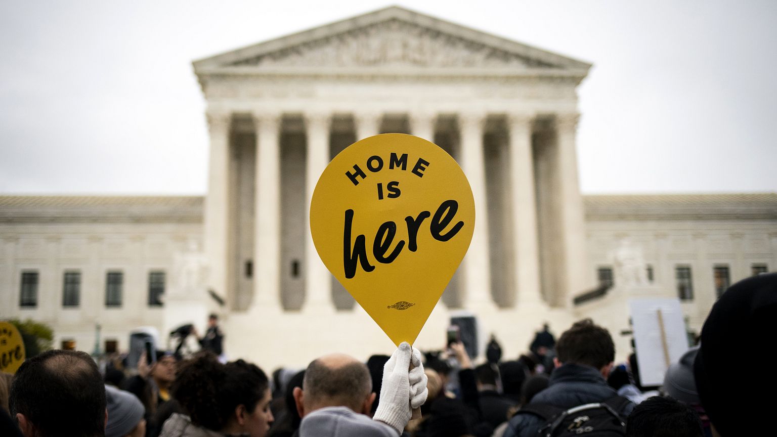 Image: A demonstrator holds a sign in support of the Deferred Action for Ch