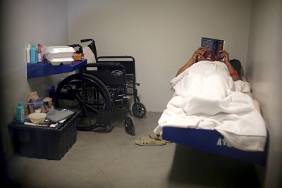 An ICE detainee lies in his cell in the segregation wing at the Adelanto immigration detention center, which is run by the Geo Group Inc (GEO.N), in Adelanto, California on April 13, 2017.