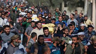 Image: Palestinians attend the funeral procession of members of the same fa
