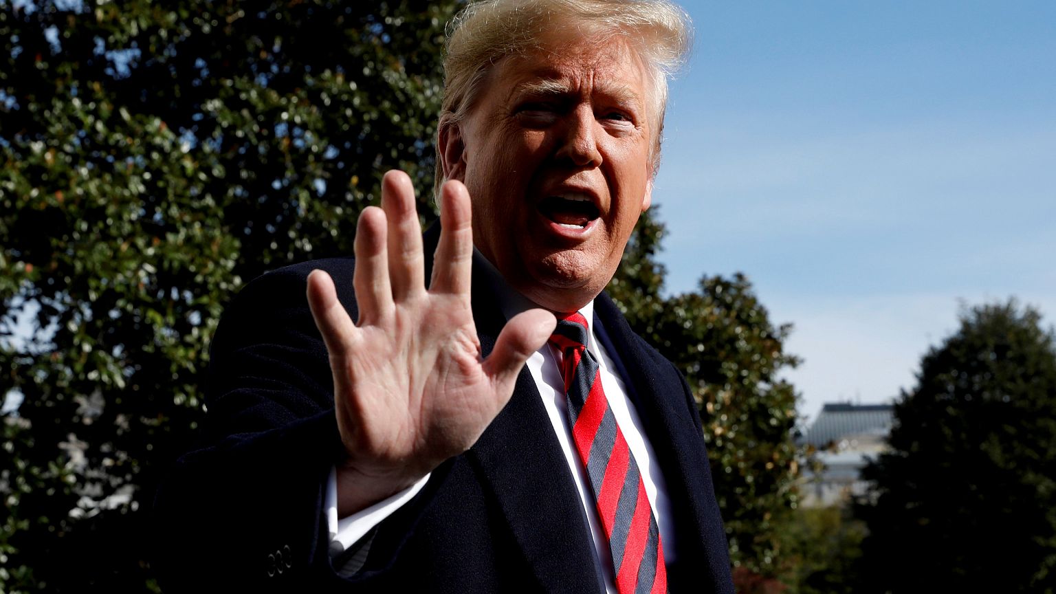 Image: President Donald Trump speaks to the media on the South Lawn of the 