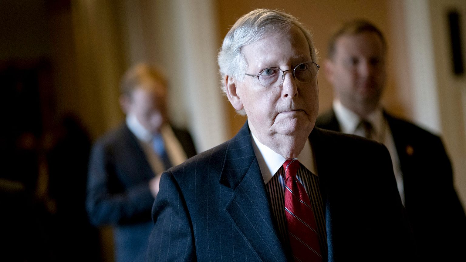 Image: Senate Majority Leader Mitch McConnell walks to his office after a p