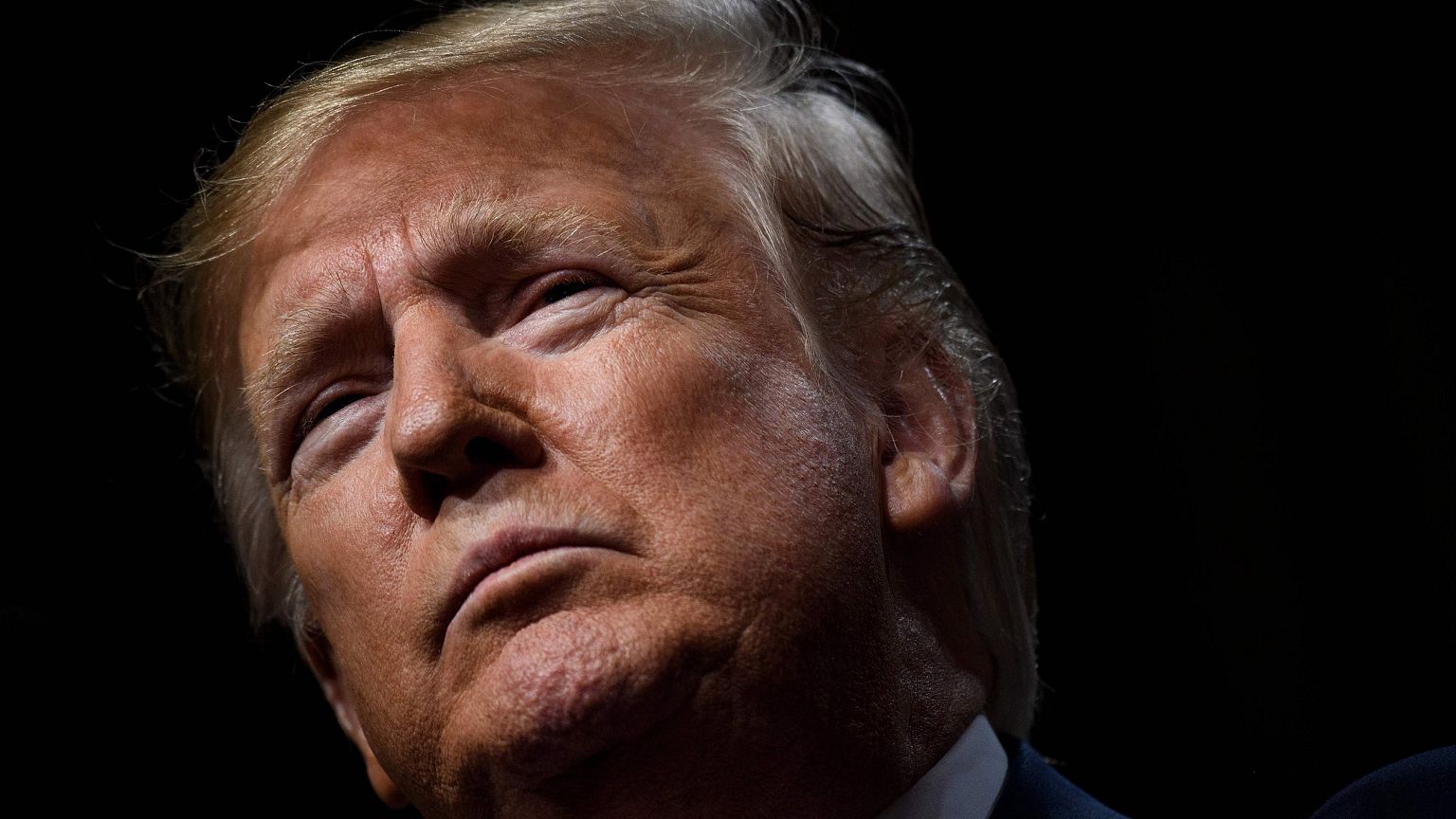 Image: President Donald Trump pauses while speaking at the Economic Club of