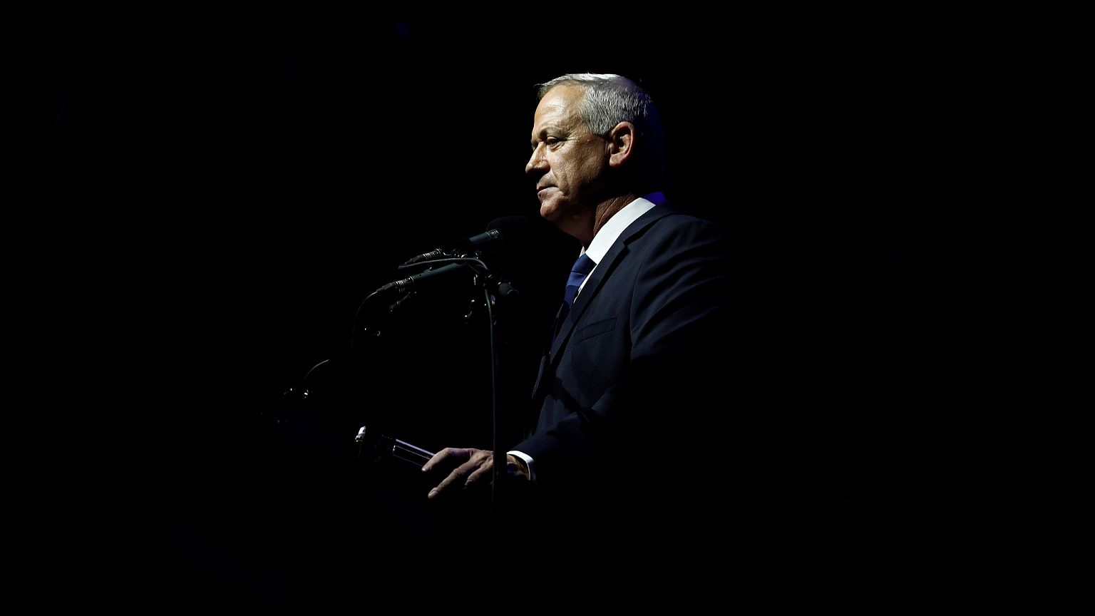 Image: Benny Gantz, head of Blue and White party, speaks during a rally com