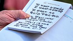 Image: President Donald Trump holds notes on Ambassador Gordon Sondland's t