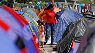 Image: FILE PHOTO: Central American migrants are seen outside their tents i