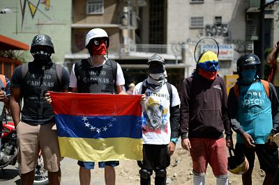 Venezuelan opposition activists demonstrate against President Nicolas Maduro in Caracas, on July 6, 2017.