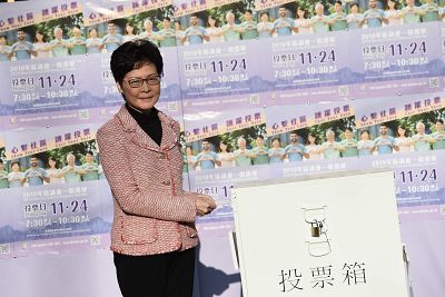Hong Kong Chief Executive Carrie Lam casts her vote in the district council elections on Sunday. 