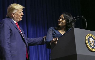 President Donald Trump with Tanesha Bannister, of Columbia, who spoke about how Trump\'s First Step program helped her get out of prison early at the David Swinton Campus Center, at Benedict College in Columbia, S.C., on Oct. 25, 2019.