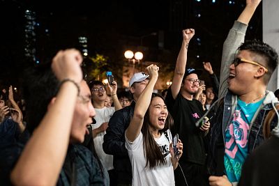 Pro-democracy supporters chant as they celebrate the loss of a pro-Beijing candidate in Hong Kong\'s district council elections on Monday. 