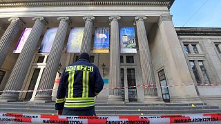 Image: A policeaman stands outside Green Vault city palace after a robery i