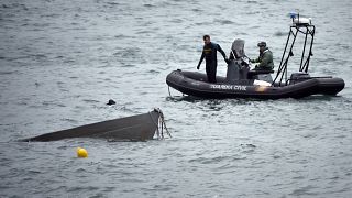 Image: The prow of a submarine used to transport drugs illegally emerges as