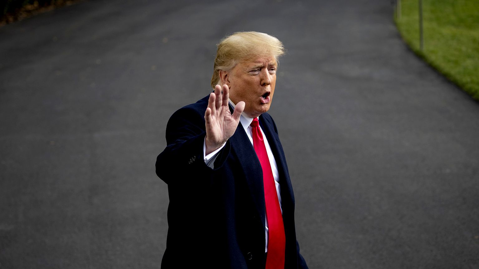 Image: President Donald Trump waves as he walks to board Marine One on the 
