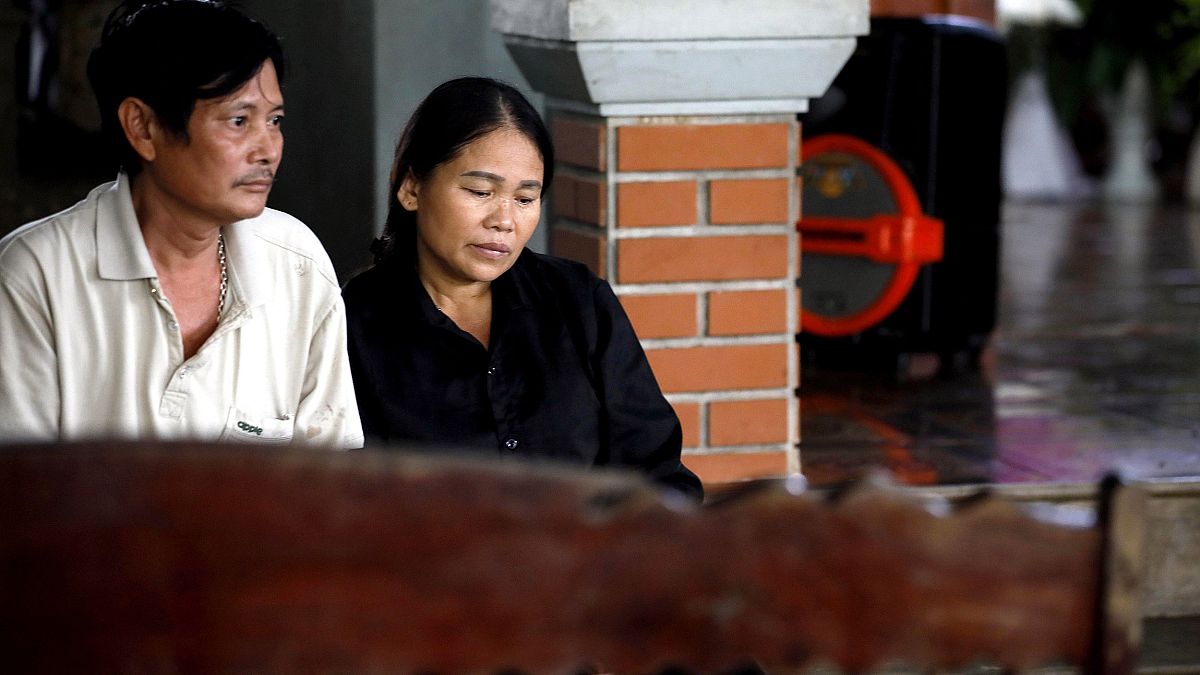 Image: Hoang Lanh, left, and Hoang Thi Ai, parents of Hoang Van Tiep, one o