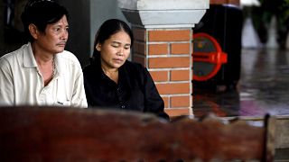 Image: Hoang Lanh, left, and Hoang Thi Ai, parents of Hoang Van Tiep, one o