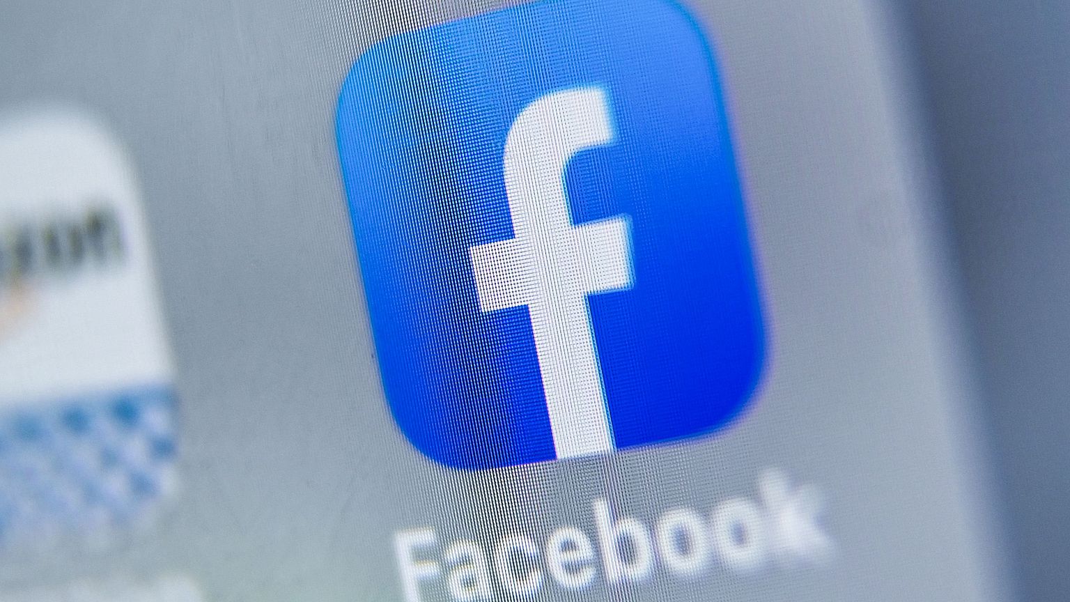 Image: The logo of Facebook is displayed on a tablet.