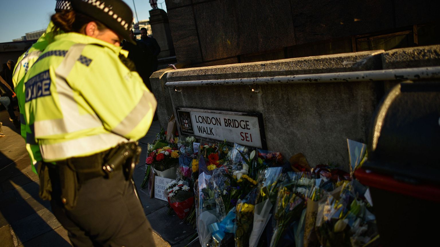 Image: Floral tributes are left for Jack Merritt and Saskia Jones, who were