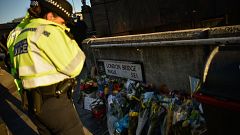 Image: Floral tributes are left for Jack Merritt and Saskia Jones, who were