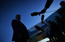 Image: President Donald Trump speaks to the press before boarding Air Force