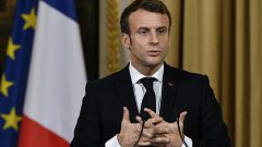 Image: French President Emmanuel Macron gestures during a joint press confe