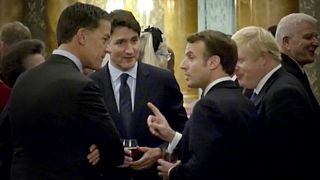 Image: French President Emmanuel Macron gestures as he speaks to Canadian P