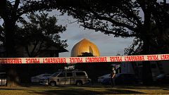 Image: A police officer stands guard in front of the Masjid Al Noor mosque 