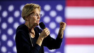 Image: Democratic presidential candidate Sen. Elizabeth Warren holds a town