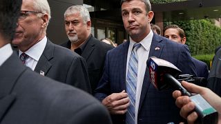 Image: U.S. Representative Duncan Hunter leaves federal court after pleadin