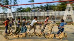 Image: Rohingya children play at a playground at Jamtola refugee camp in Uk