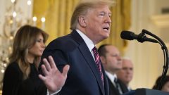 Image: President Donald Trump, with first lady Melania Trump, speaks during