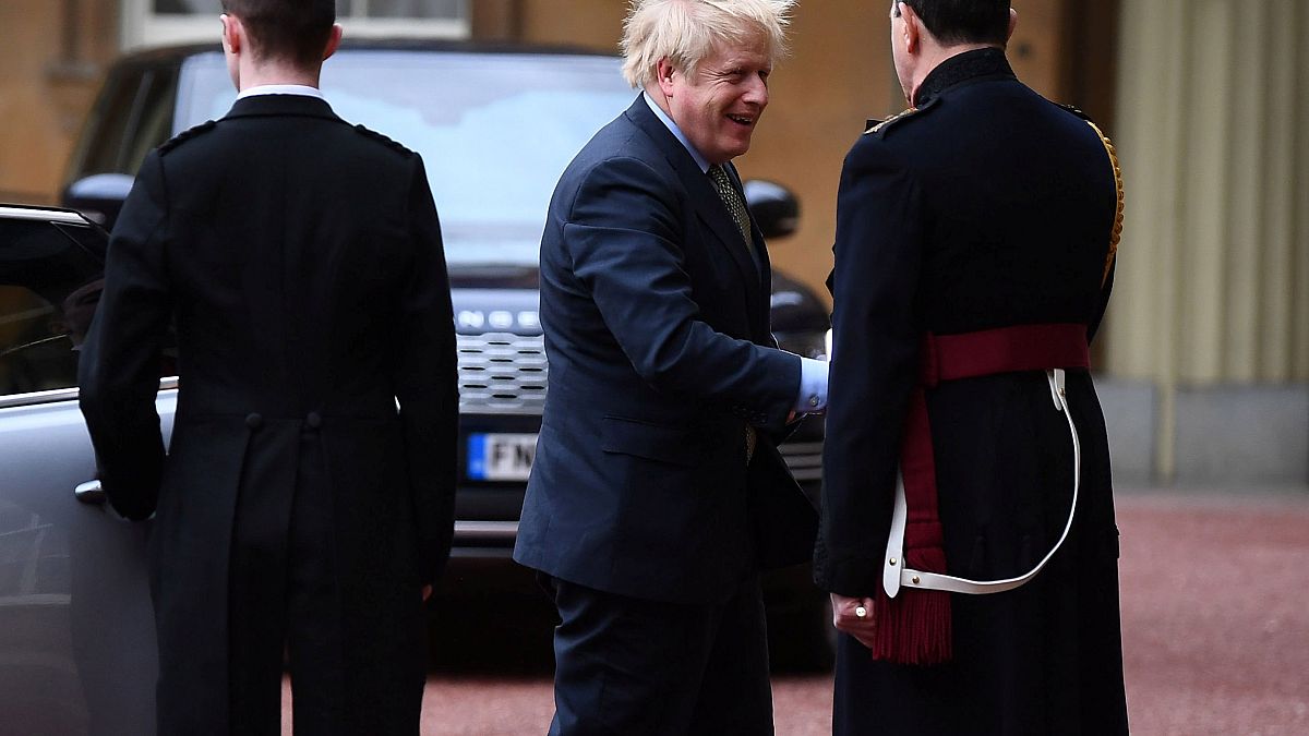 Image: Prime Minister Boris Johnson is greeted by the Queen's Equerry-in-Wa