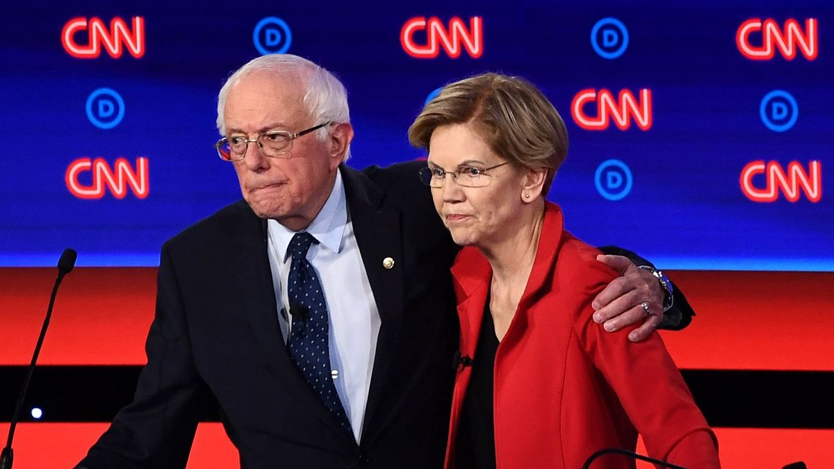 Image: Bernie Sanders and Elizabeth Warren hug after participating in the s