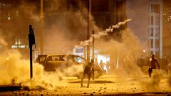 Image: Demonstrators hurl tear-gas canisters back at riot police in Beirut,