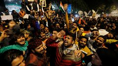Image: Demonstrators shout slogans during a protest against a new citizensh