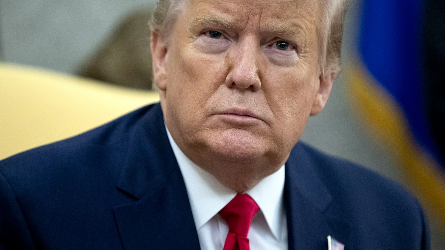 Image: President Donald Trump listens to questions in the Oval Office on De