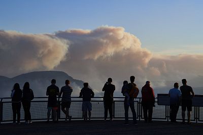People view smoke from scattered bush fires on a look out platform in the Blue Mountains on Dec. 4, 2019 in Katoomba, Australia.